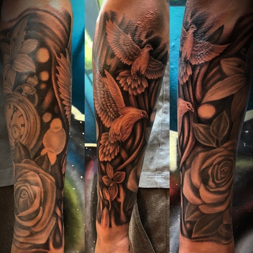 Find flower thigh tattoo ideas for your next unique tattoo in Ambler at Tattoo GalaxyAmbler Piercing & Custom Tattoos
