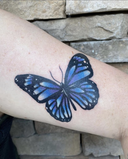 Explore butterfly back tattoo ideas, creative tattoo ideas in Davenport, available at Fine Ink Studios Tattoos