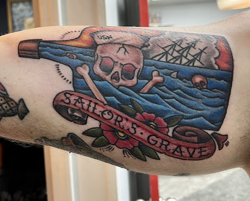 Explore paintbrush tattoo ideas, creative tattoo ideas in Orange Park, available at All Aces Tattoo and Body Piercing LLC