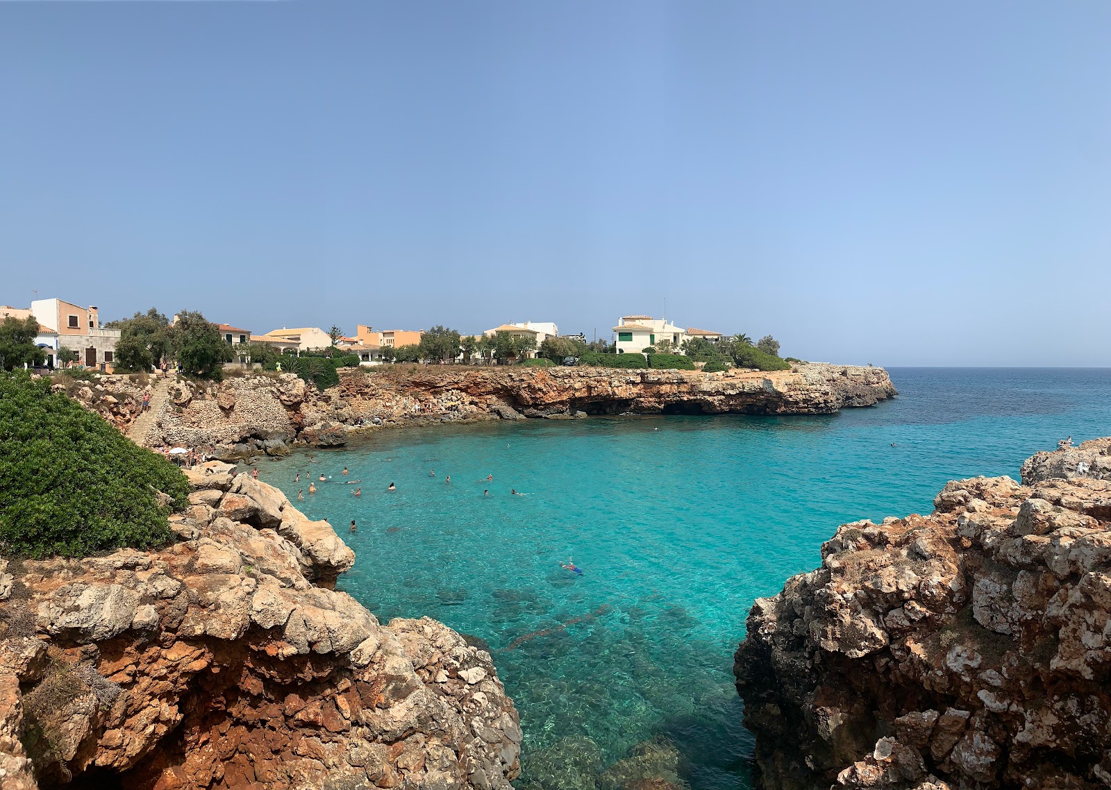 Photo of Cala Morlanda with blue pure water surface