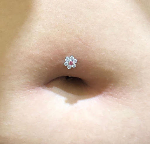 Explore under breast tattoo ideas for females, creative tattoo ideas in Athens, available at Pain and Wonder Tattoo and Piercing Studio