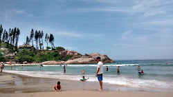 Photo de Plage de Joaquina protégé par des falaises
