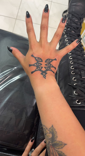 Explore anime neck tattoo ideas, creative tattoo ideas in Schaumburg, available at Atmosphere Tattoo Gallery - Schaumburg