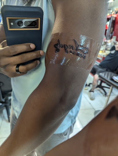 Explore anime hand tattoo ideas, creative tattoo ideas in Honolulu, available at Sacred Art Tattoo Waikiki