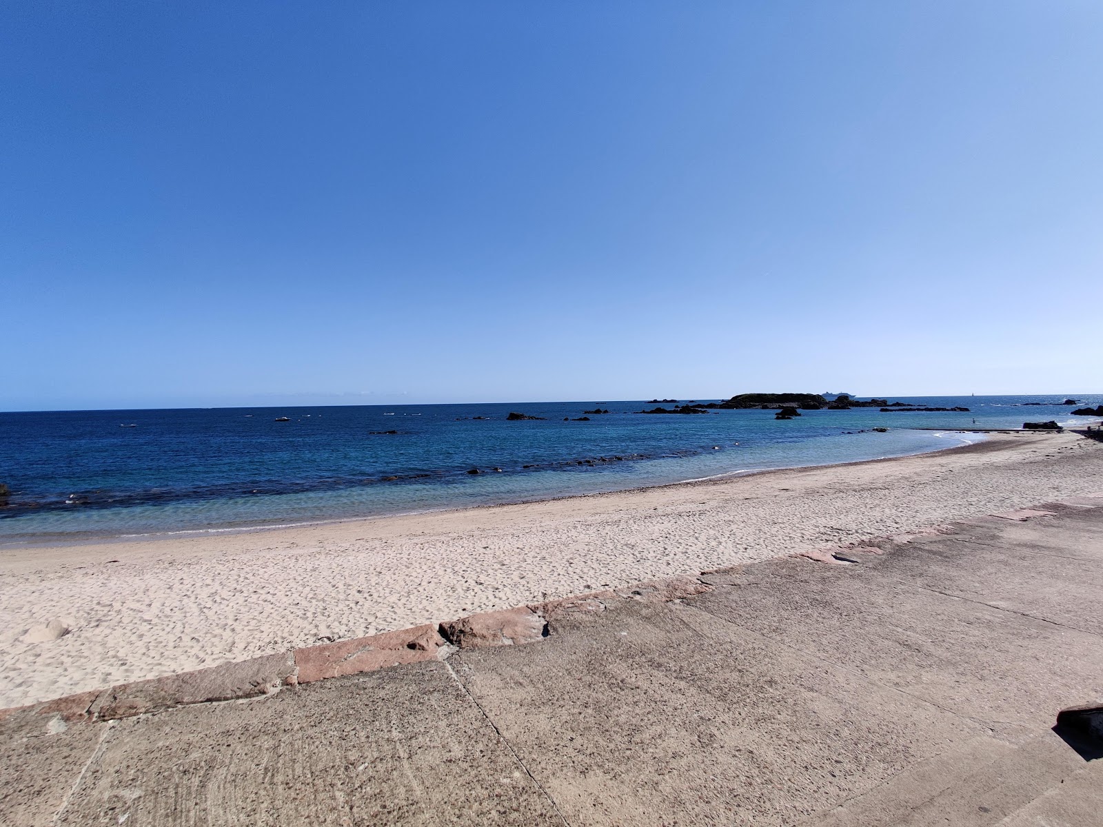 Foto von Green Island Beach mit türkisfarbenes wasser Oberfläche
