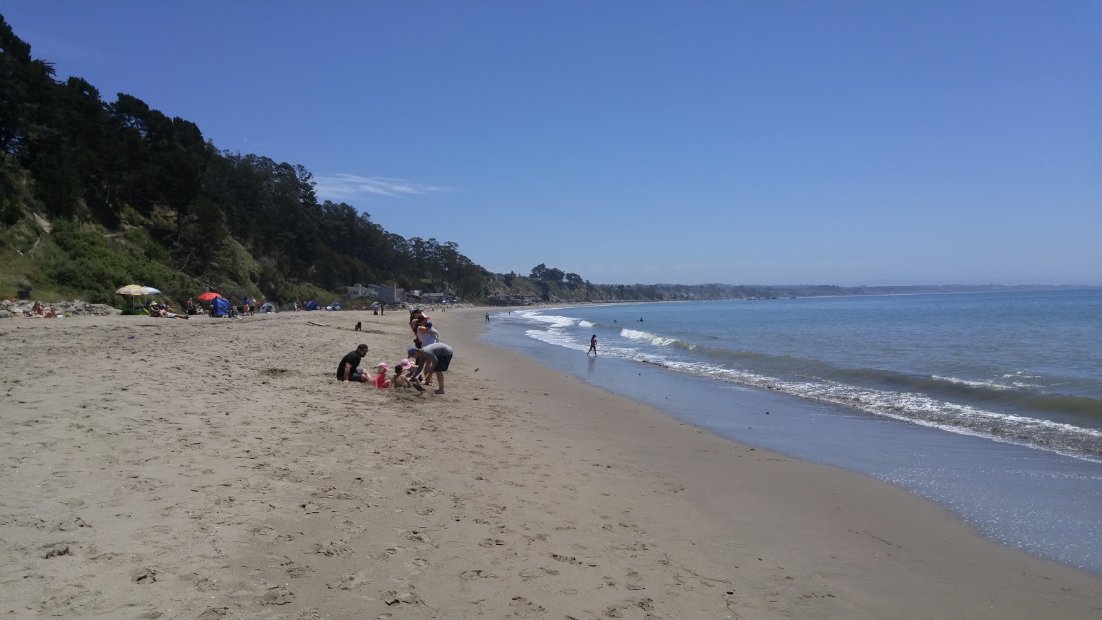 Fotografie cu New Brighton Beach cu o suprafață de apa turcoaz