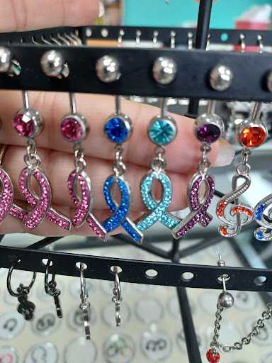 Explore small coraline tattoo ideas, creative tattoo ideas in Altoona, available at Piercings by Pez
