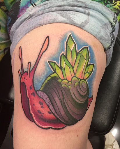 Explore snapdragon tattoo ideas, creative tattoo ideas in Addison, available at Cat Tattoo