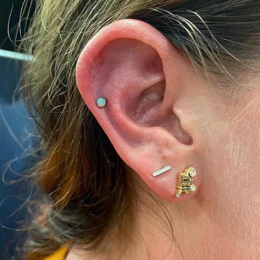 Explore kneecap tattoo ideas, creative tattoo ideas in Dubuque, available at Julia Frank Piercing