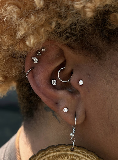 Explore hourglass tattoo ideas, creative tattoo ideas in Hampton, available at Luna Estelle Body Piercing Studio