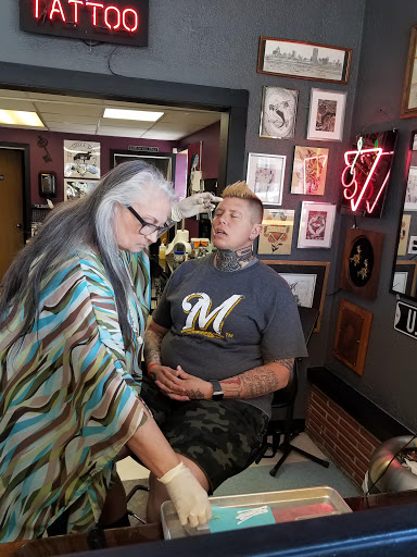 Explore cover up arm tattoo ideas, creative tattoo ideas in Milwaukee, available at Bay Street Tattoo Co.