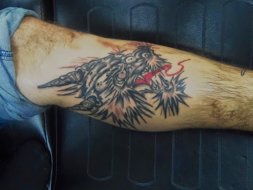 Explore golden retriever tattoo ideas, creative tattoo ideas in Sarasota, available at Z-Edge Tattoo and Body Piercing North Shop