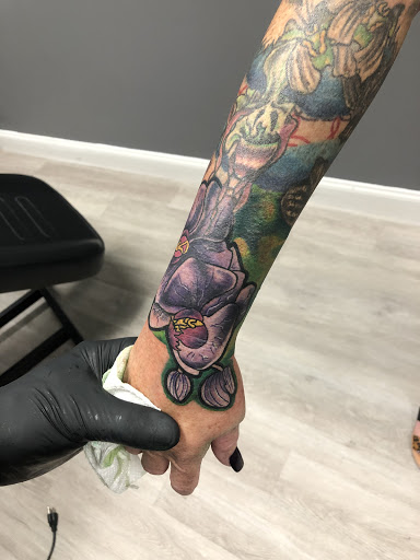 Explore half sleeve tattoo ideas for women, creative tattoo ideas in Lakeland, available at Lyons Den Tattoo Company