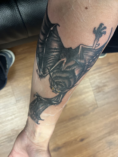 Explore hood tattoo ideas, creative tattoo ideas in Hinesville, available at Dark Horse Art Studios