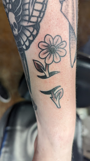 Explore hippy tattoo ideas, creative tattoo ideas in Des Moines, available at Iron Heart Tattoo