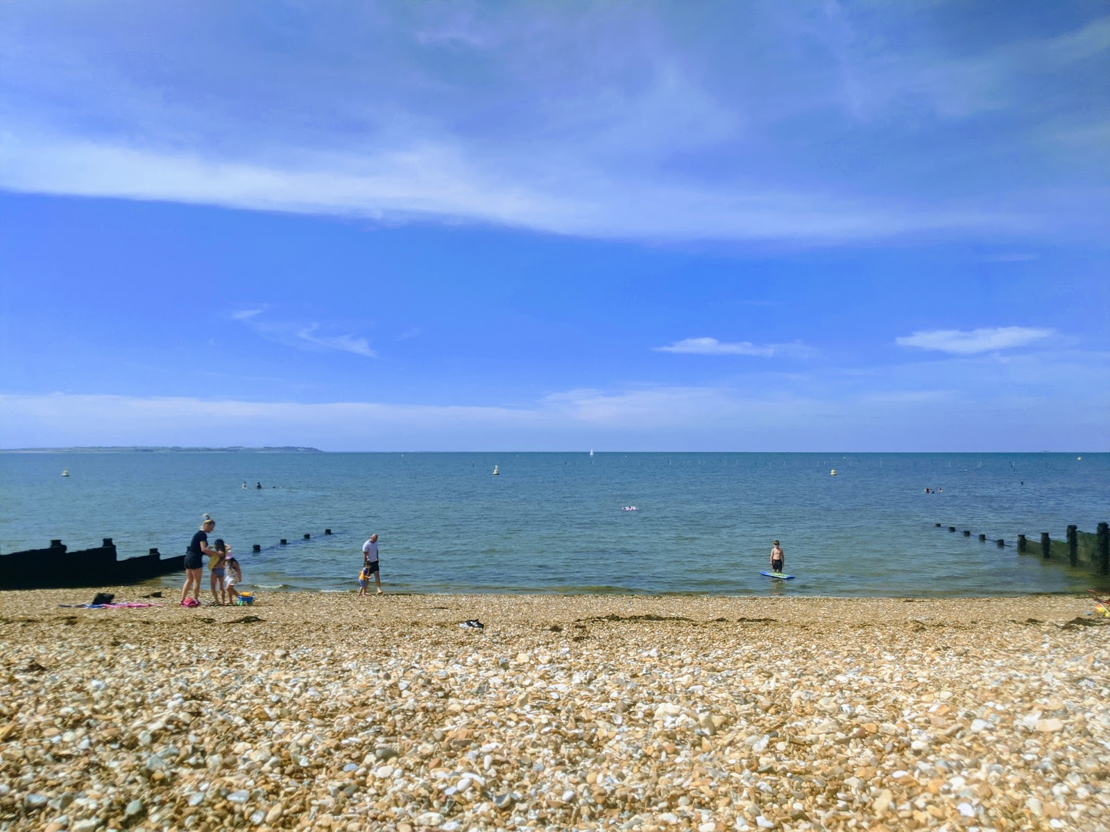 Photo of Whitstable Beach with blue water surface