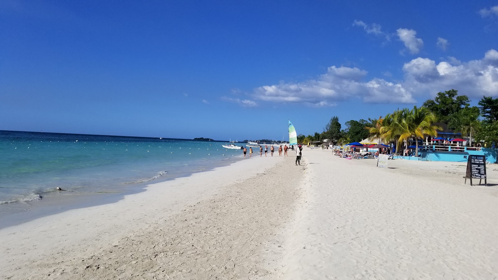 Photo of Norman Manley Beach with bright fine sand surface