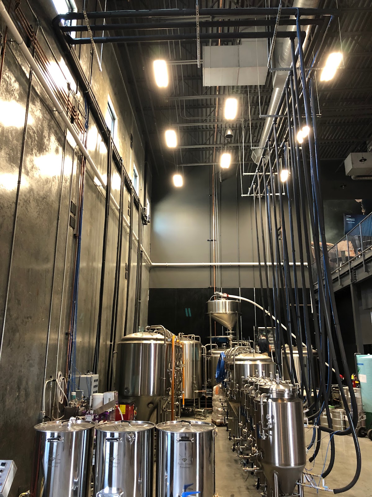 Beer taps lined up on a bar