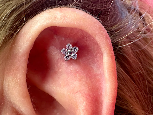 Explore mens behind ear tattoo ideas, creative tattoo ideas in Memphis, available at Rose Quartz Body Adornment LLC