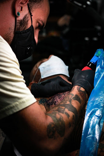 Explore hand tattoo idea, creative tattoo ideas in Stockbridge, available at Black Rose Tattoo Collective