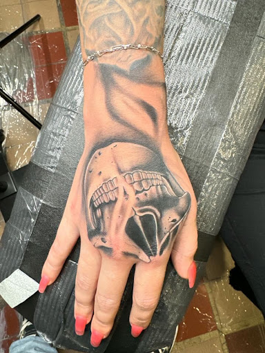 Explore book dragon tattoo ideas, creative tattoo ideas in Ogden, available at Legacy Tattoo