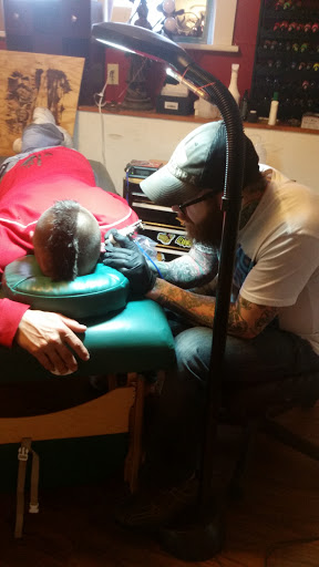 Explore forehead tattoo ideas, creative tattoo ideas in Milford, available at Golden Hammer Tattoo Studios