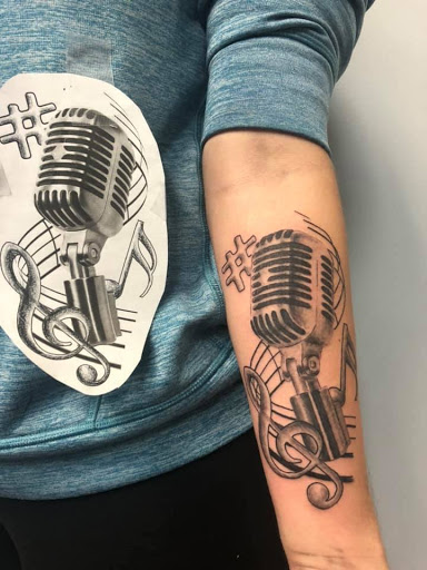 Explore ribbon tattoo ideas, creative tattoo ideas in Oxford, available at Victorian Ink