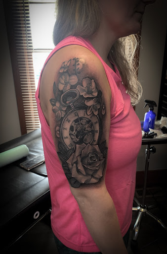 Explore feminine arm tattoo ideas, creative tattoo ideas in Warrensburg, available at Altered Visions Tattoo Studio
