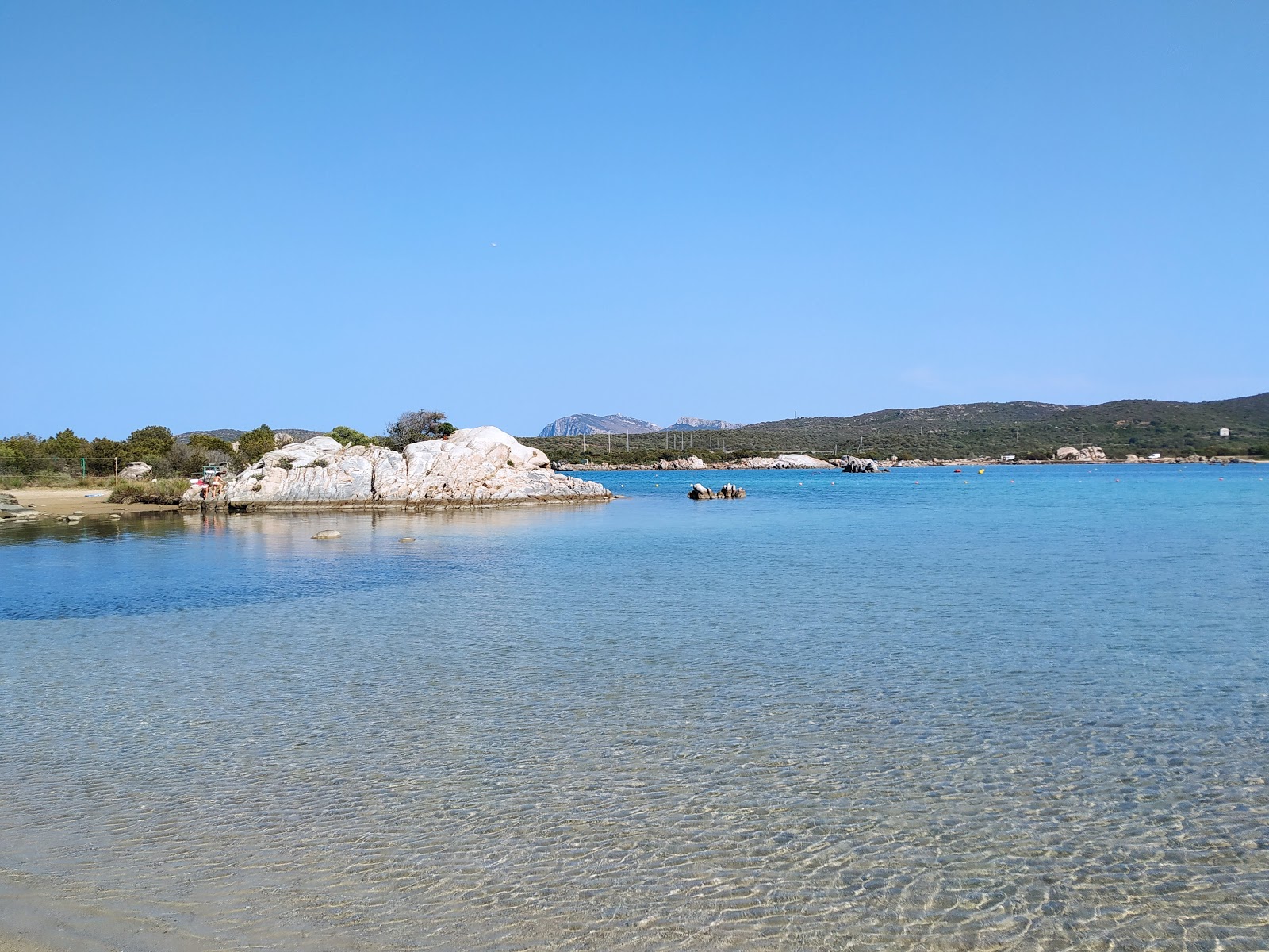 Photo of Cala Marana with blue pure water surface