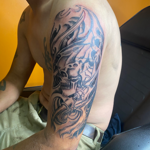 Explore mens rose tattoo ideas, creative tattoo ideas in Gadsden, available at Savage City Ink LLC