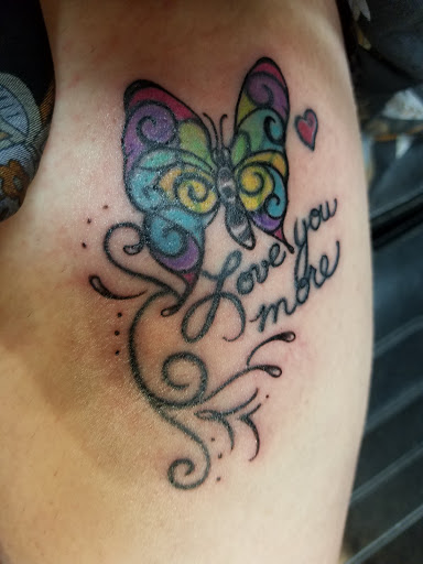 Explore neck tattoo ideas woman, creative tattoo ideas in Johnson City, available at Defiant Designs