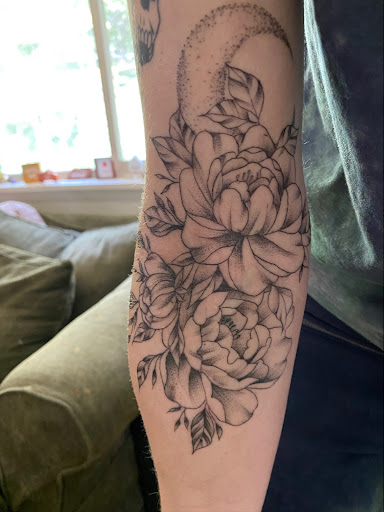 Explore cover up tattoo ideas female leg, creative tattoo ideas in Buffalo, available at Vagabond Ink Tattoo Parlor