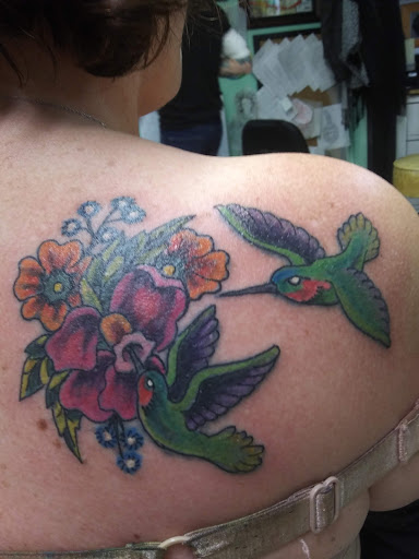 Explore large flower tattoo ideas, creative tattoo ideas in Austin, available at Moms Tattoos