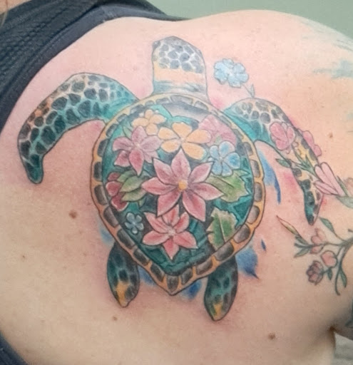 Explore one piece tattoo ideas for guys, creative tattoo ideas in Ocala, available at Lone Wolf Tattoo