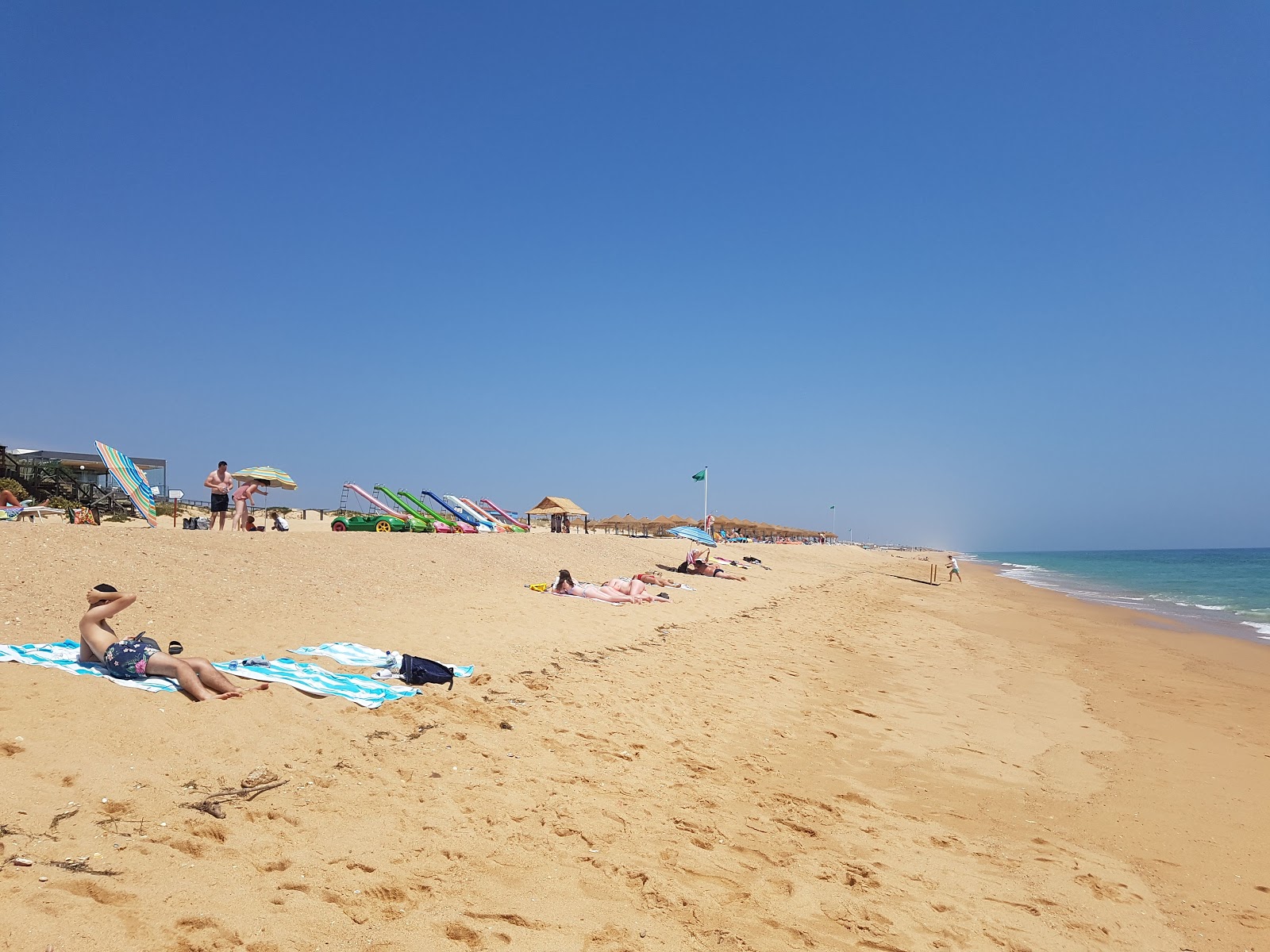 Foto di Spiaggia di Garrao Nascente con una superficie del sabbia fine marrone