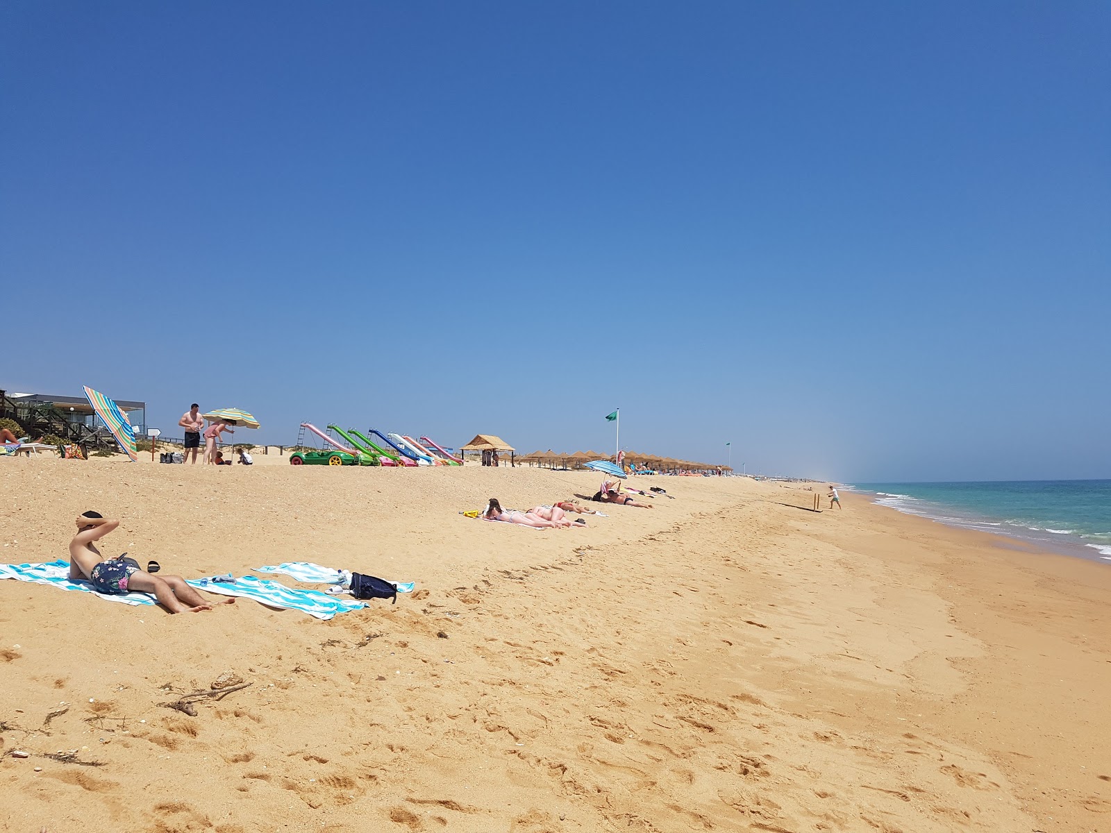 Photo de Plage de Garrao Nascente avec sable fin brun de surface