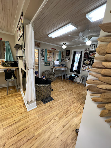 Find book of tattoo ideas for your next unique tattoo in Bayfield at Benchmark Tattoo