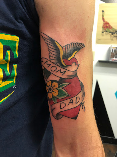 Explore skinny guys tattoo ideas, creative tattoo ideas in Alamosa, available at The Shop Tattoo & Comics