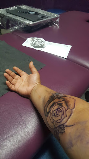 Explore rip tattoo ideas for females, creative tattoo ideas in Houston, available at Ink Love Tattoos