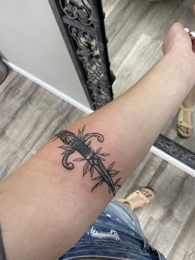 Explore lone wolf tattoo ideas, creative tattoo ideas in Vermilion, available at Reflection Room Tattoo Co. Academy