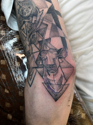 Explore rock tattoo ideas, creative tattoo ideas in Woodside, available at Vitruvian Tattoo Culture