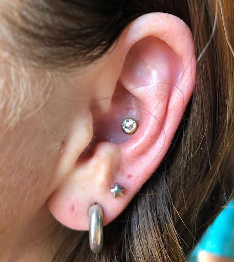 Explore belly button tattoo ideas, creative tattoo ideas in Asheboro, available at Blue Luna Tattoo Company, LLC