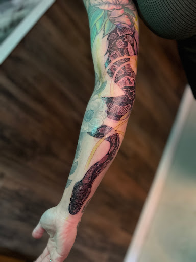 Explore front thigh tattoo ideas, creative tattoo ideas in Hudson, available at The Bohemian Social Club