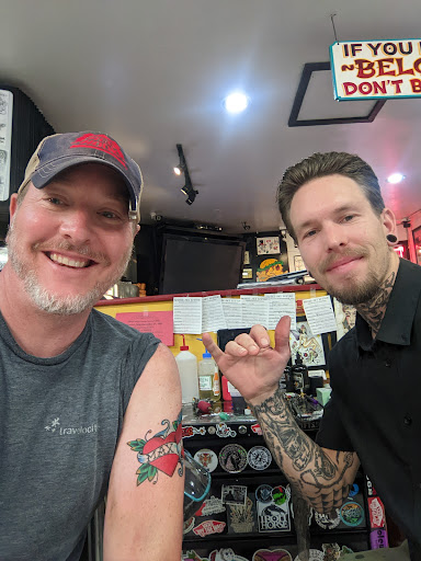 Explore cat outline tattoo ideas, creative tattoo ideas in Honolulu, available at Sacred Art Tattoo Waikiki