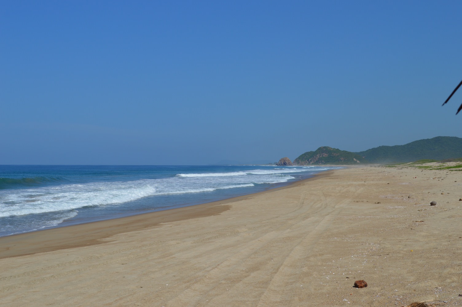 Playa el Coco'in fotoğrafı kahverengi kum yüzey ile