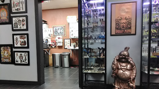 Find between the boob tattoo ideas for your next unique tattoo in San Antonio at Buddha Box Studios