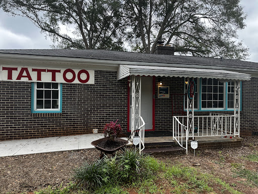 Explore falling in reverse tattoo ideas, creative tattoo ideas in Greer, available at Inkslingers Electric Tattooing