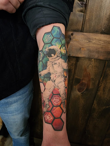 Explore one piece tattoo ideas, creative tattoo ideas in Green Bay, available at The Blue Gem Tattooing