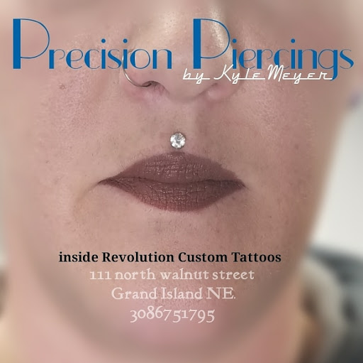 Find small tree tattoo ideas for your next unique tattoo in Grand Island at Precision Piercings