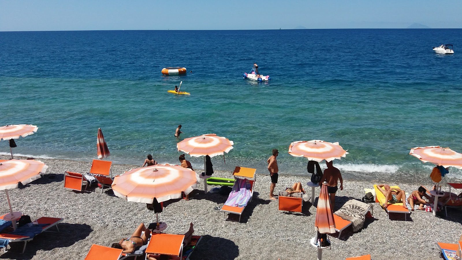 Foto af Capo Calava Strand med turkis rent vand overflade